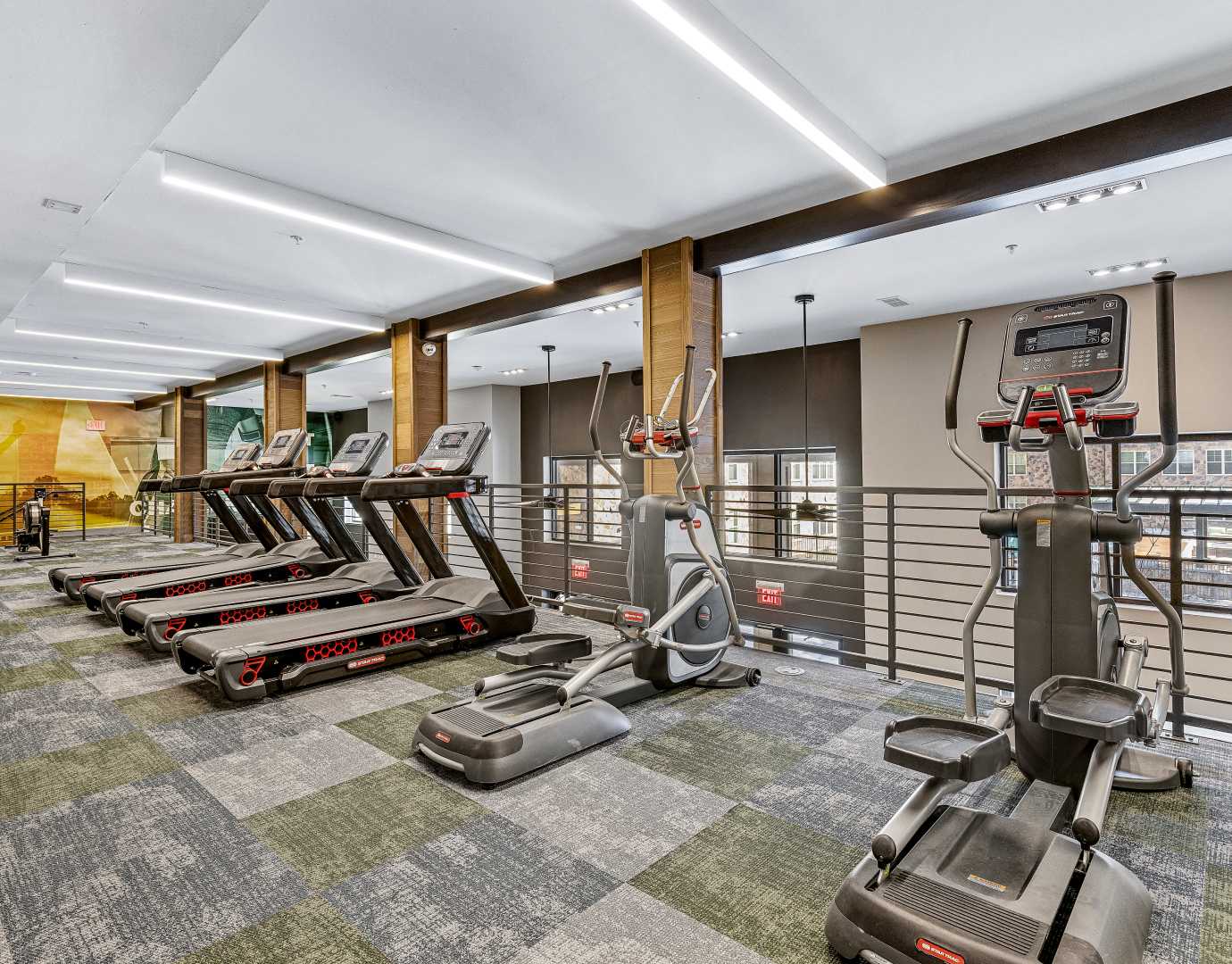 A fitness center with cardio equipment